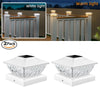 A set of two white solar post cap lights with warm LED for outdoor fencing and decking.