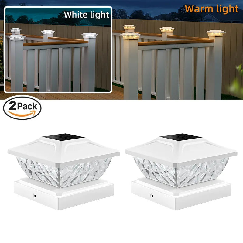 A set of two white solar post cap lights with warm LED for outdoor fencing and decking.