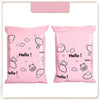 Two pink self-sealing mailing bags featuring a white outline of a bear and clouds.
