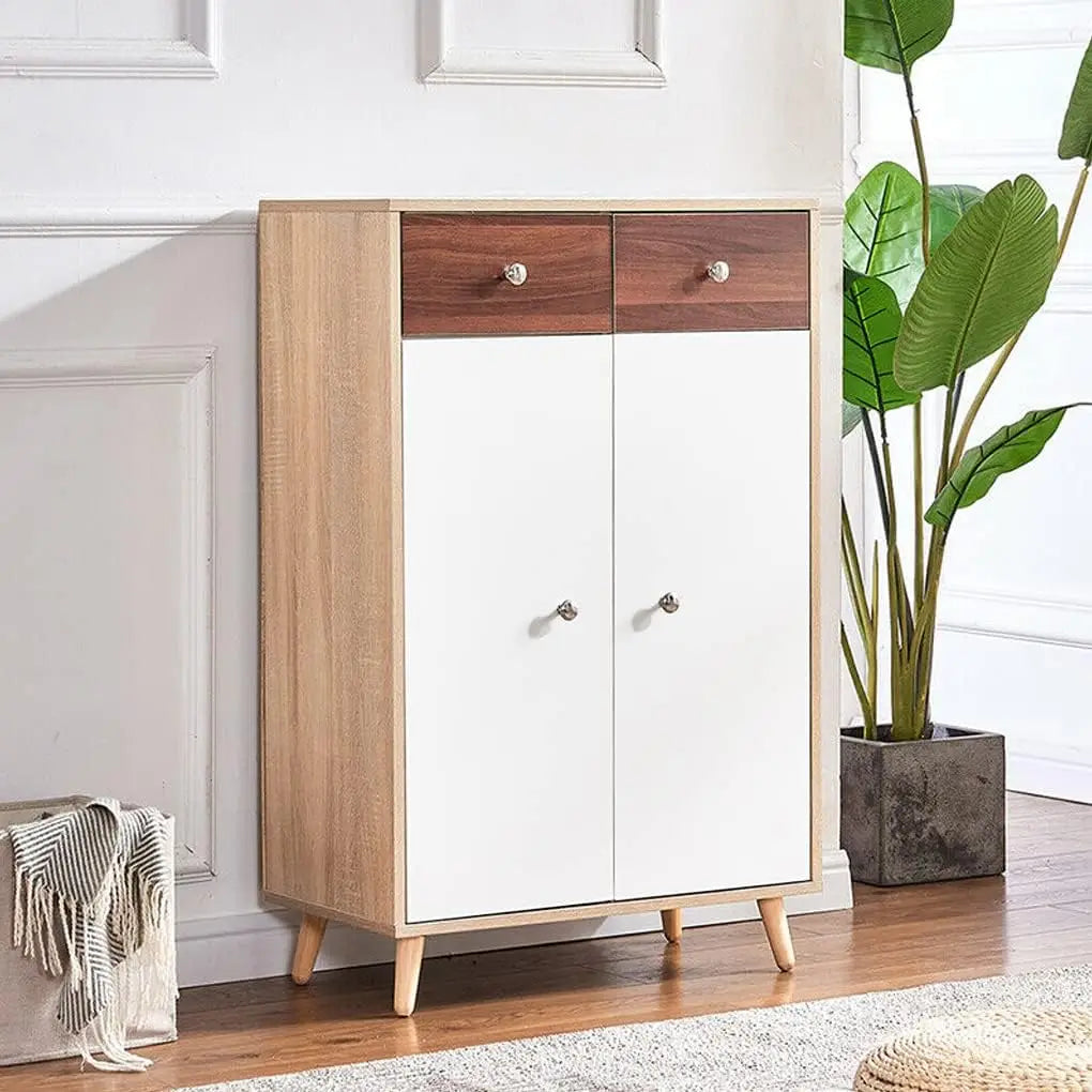 A light wood cabinet with white doors and a dark wood accent, featuring self-adhesive matte white vinyl wallpaper.