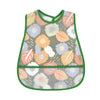 A green and patterned waterproof baby feeding bib with a catch pocket.