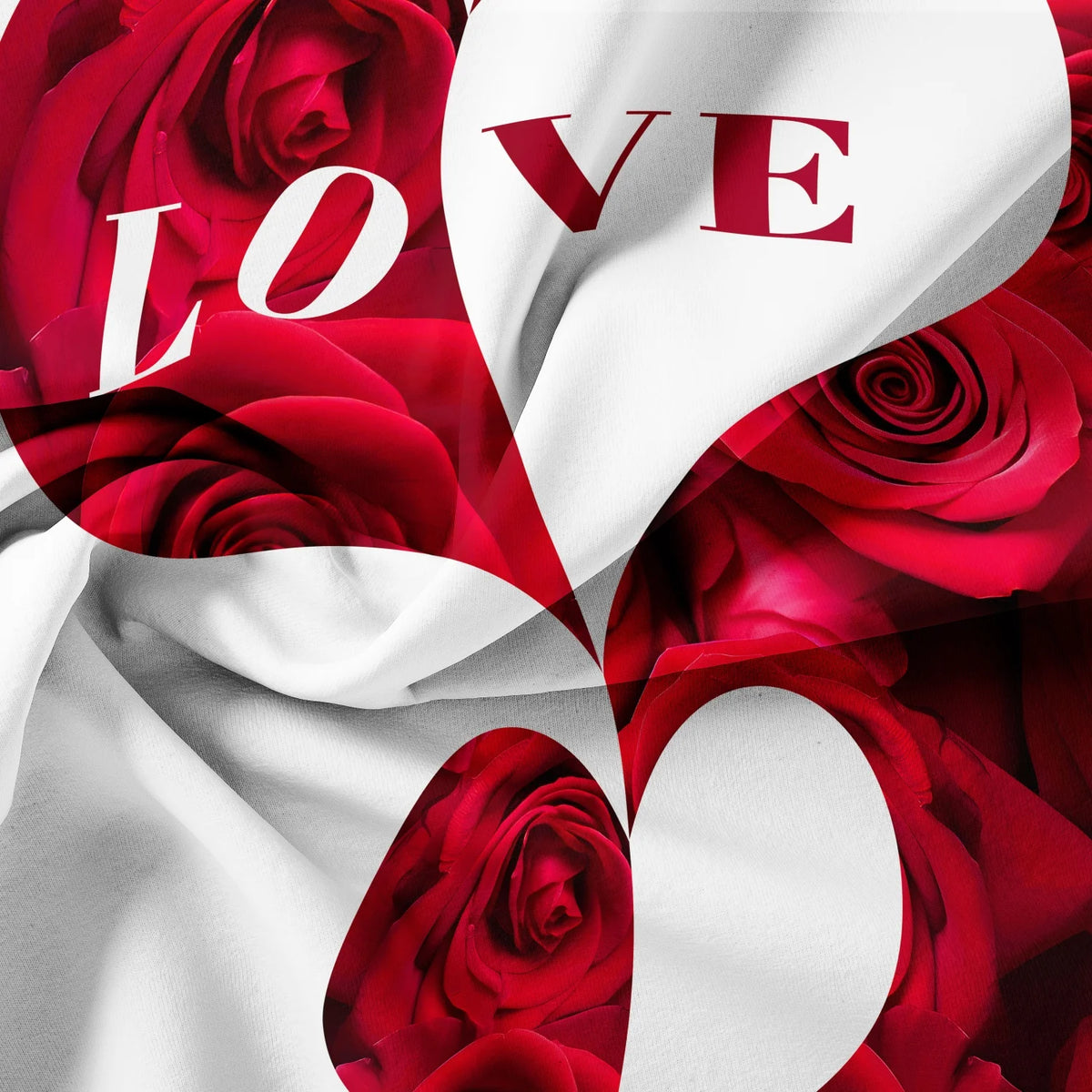 A close-up of a fabric featuring red roses and the word LOVE in white text on a white background.