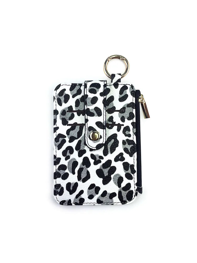 A black and white leopard print PU leather card holder with a coin pocket and keychain.