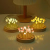 Handcrafted tulip LED night light with wooden base featuring glowing flowers.