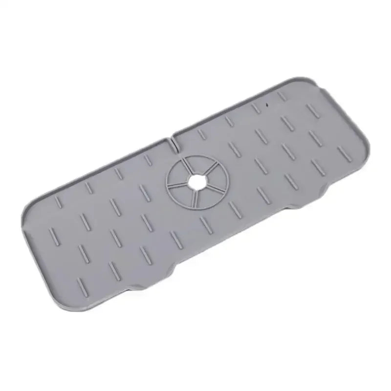 Gray silicone kitchen sink mat designed to protect the faucet from splashes.