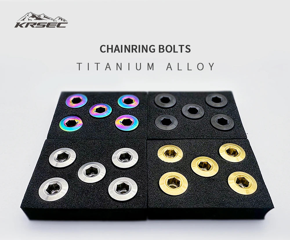A set of titanium alloy chainring bolts displayed on a black background.