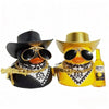 A pair of black and yellow cowboy rubber duck car ornaments with gold accents and a Corona Extra bottle.