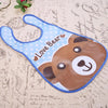 A blue and brown silicone bib shaped like a bear with a catch-all pocket for weaning toddlers.