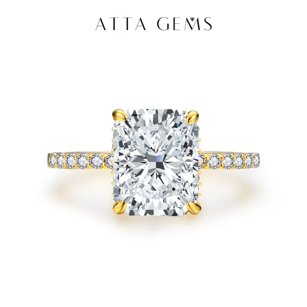 A radiant cut moissanite engagement ring featuring a hidden halo set in gold and diamonds.