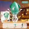 A green electric squid toy with white tentacles is shown against a blurred background.