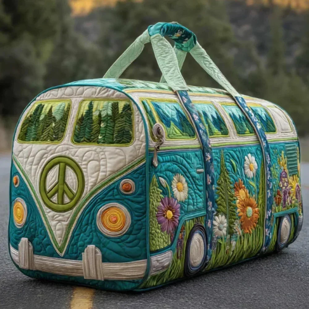 A quilted travel duffle bag shaped like a vintage train car with green and floral stitching.