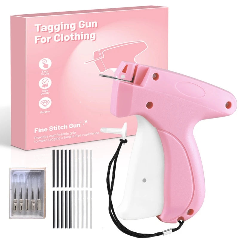 Pink tagging gun for clothing with a white grip and a box showing the product details.