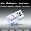 A white mini mechanical keyboard featuring hot-swappable switches and an RGB backlit keycap with a multimedia knob.