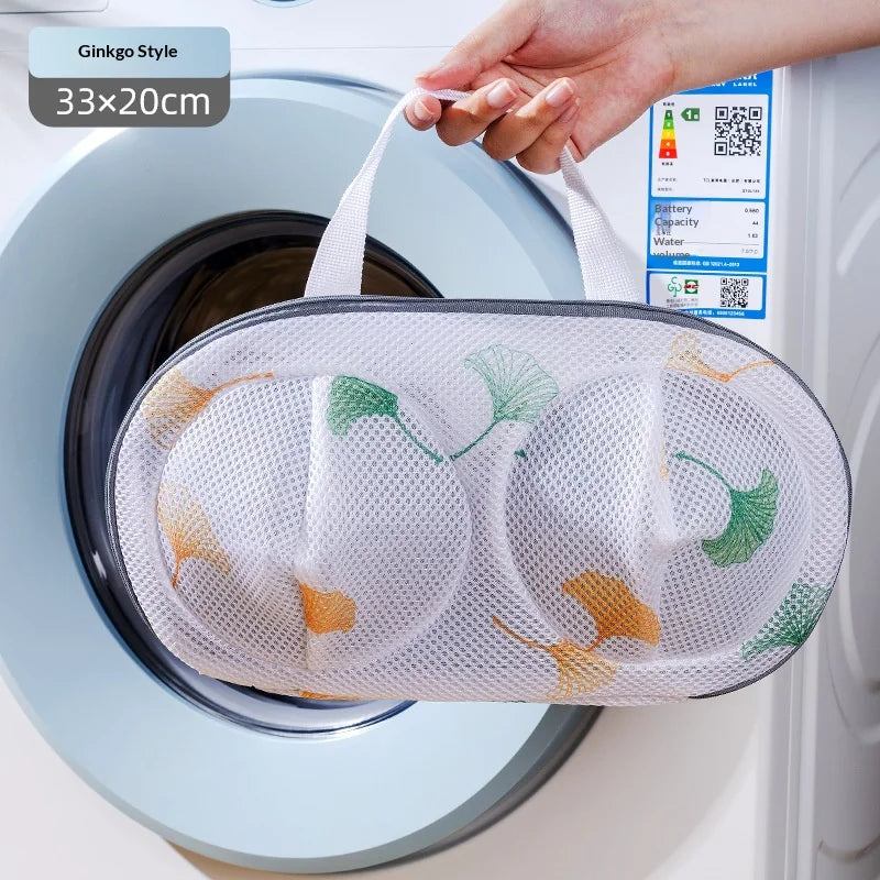 A white mesh laundry bag is shown inside a washing machine drum, with a hand holding the bag.
