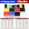 A box of heat shrink tubing kit containing various colored and sized black, yellow, blue, red, and green tubing.