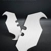 A white whole heat treatment blade is shown in a V-shape against a dark background.