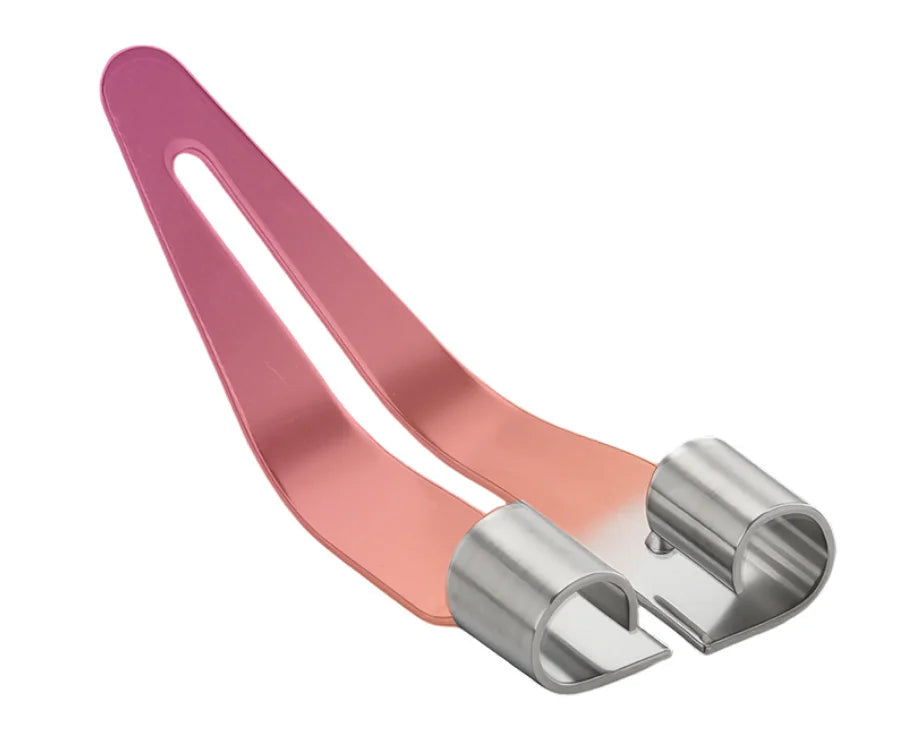 A pink plastic welding repair kit with smooth silver tips shown at an angle.
