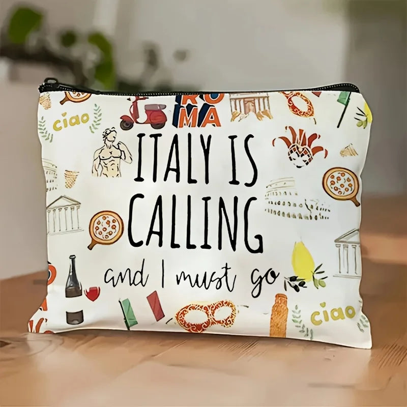 A white zippered pouch decorated with Italian travel motifs like landmarks, citrus fruits, and the word Italy calling.