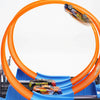 A DIY stunt racing car track set featuring an orange loop and dual-lane races with a small race car on the track.