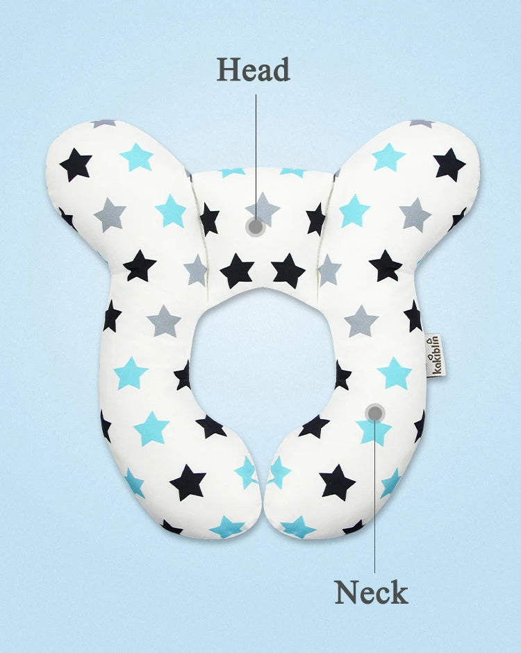 A white baby head and neck support pillow featuring black and light blue stars, shown with labels pointing to the head and ne