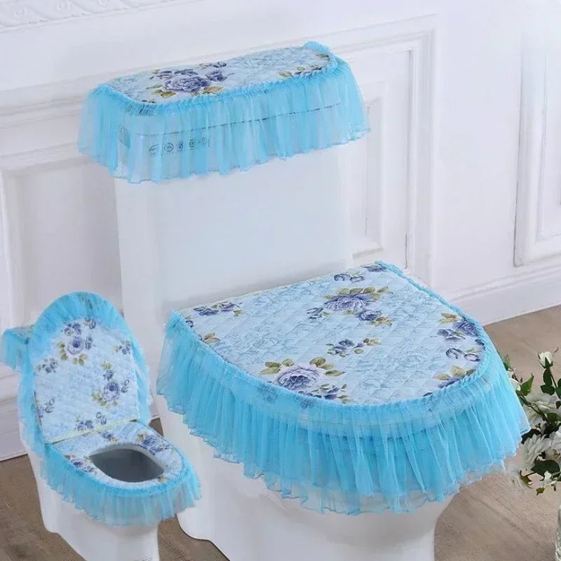 A white toilet seat fitted with a light blue antibacterial cover and ruffled cushion.