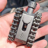 A hand holds a metal tactical tank fidget spinner with a rotating turret, featuring a silver body and chrome gears.