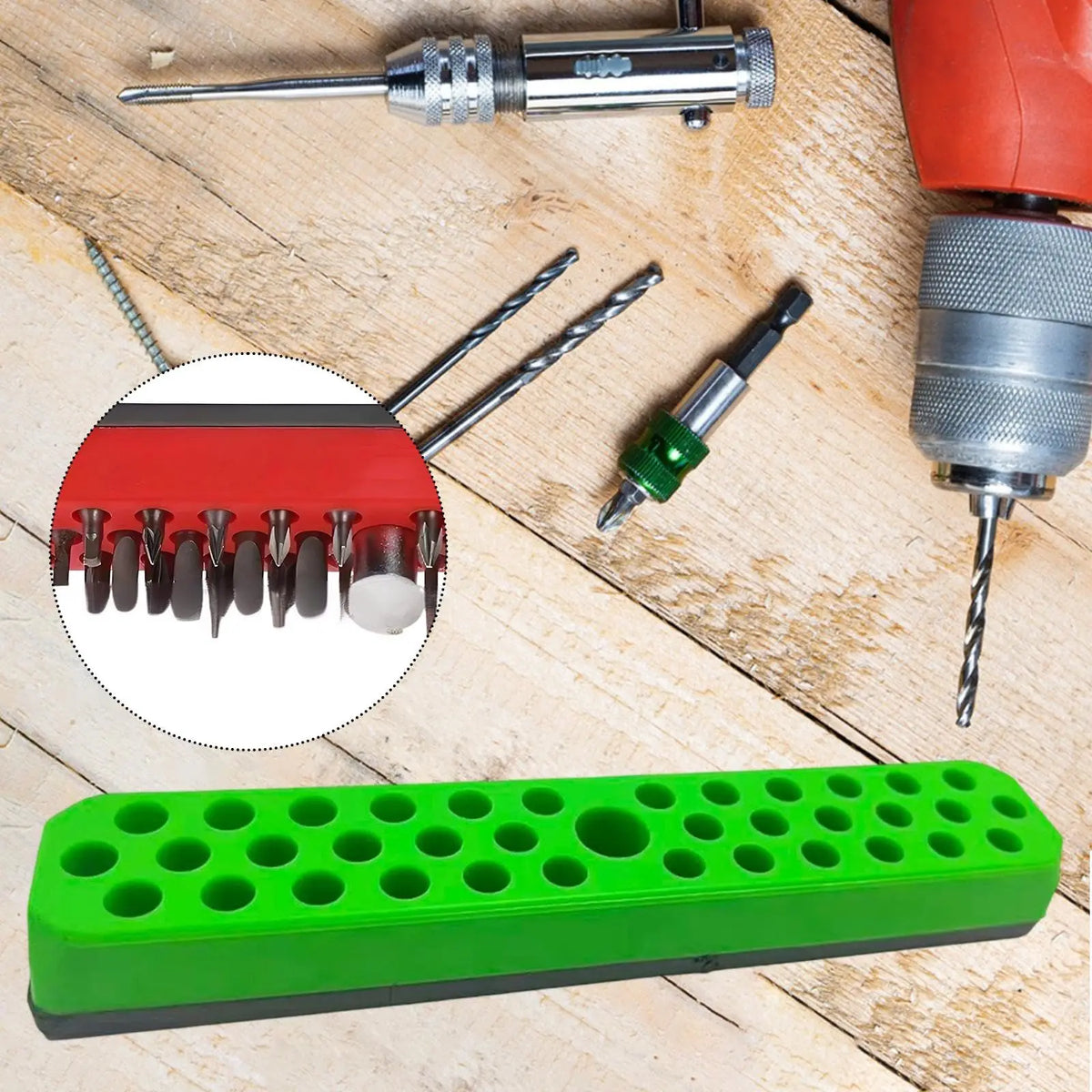 A magnetic 37-slot screwdriver bit holder rack with various screwdriver bits and a green plastic storage box.