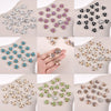 A collection of pearlized resin flower beads in various colors and finishes for DIY jewelry and crafts.