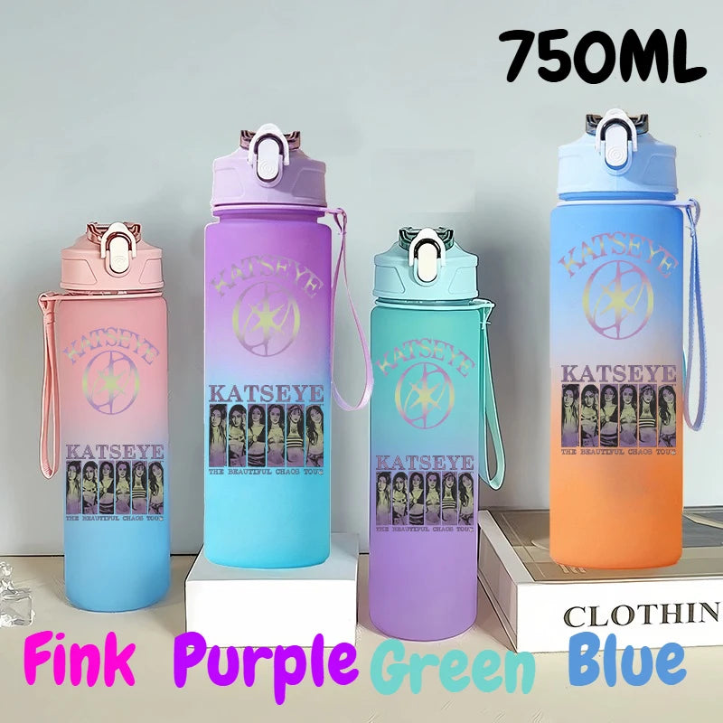 A set of three 750ml portable sports water bottles in pink, purple, and blue colors displayed on a white surface.
