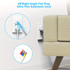 A white 45 degree right angle flat plug extension cord is shown next to a beige sofa.