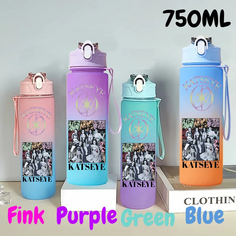 A set of three 750ml portable sports water bottles in pink, purple, and blue colors displayed on a white surface.