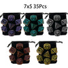 A set of 35 multi-sided polyhedral dice in various colors and shapes packaged in black pouches.