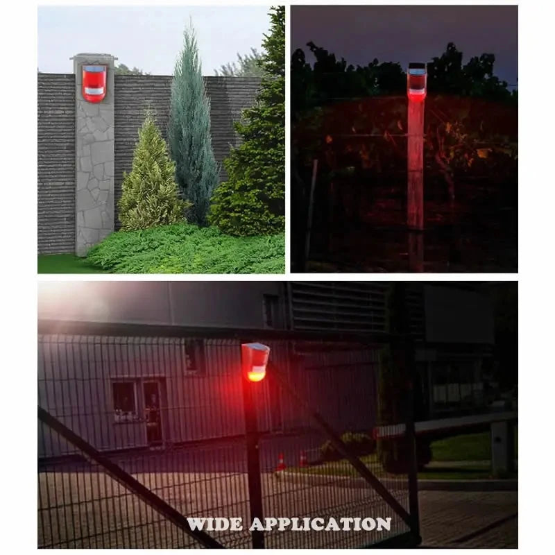 A solar-powered motion sensor alarm with a red strobe light mounted on a pole, demonstrating wide application.