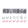 Assortment of silver jewelry findings including clasps, jump rings, and crimps packaged in small plastic containers.