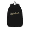 Black backpack with the name Michael written in gold script on the front.
