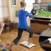A woman is using a Wii to HDMI Adapter Converter device on the floor.