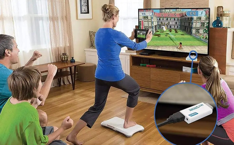 A woman is using a Wii to HDMI Adapter Converter device on the floor.