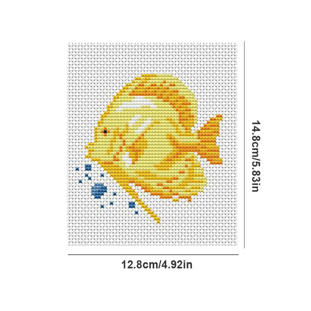 A cross stitch design featuring a yellow fish with blue accents on a white background.
