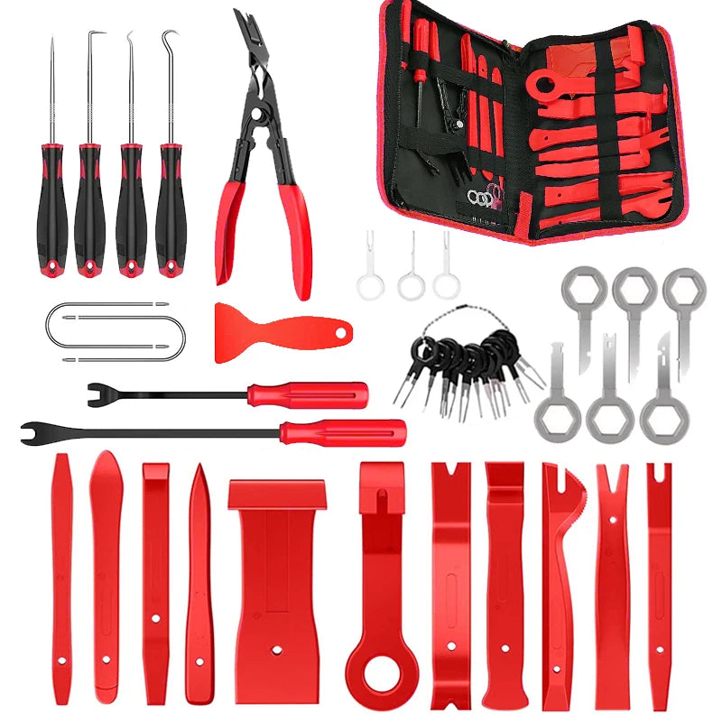 A collection of red and black car trim removal tools, including pliers, cutters, and various specialized tools, stored in a p