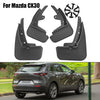 Set of black mud flaps for a Mazda CX30 vehicle, showing front and rear splash guards.