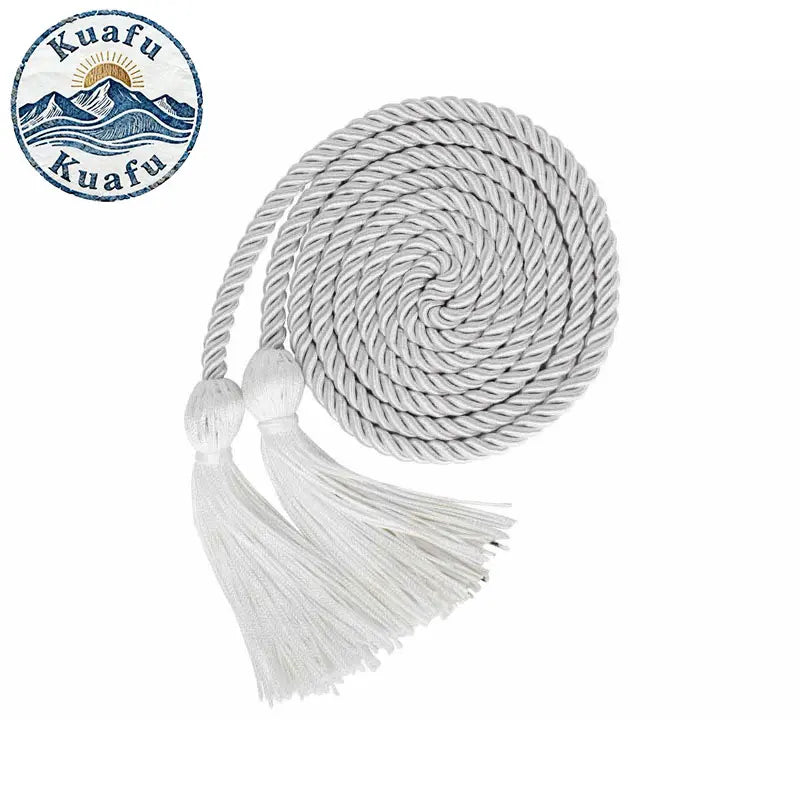 White graduation honor cords with double fringe tassels coiled on a spool