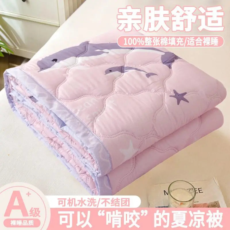 Pink quilted blanket for babies and children, featuring a purple design.