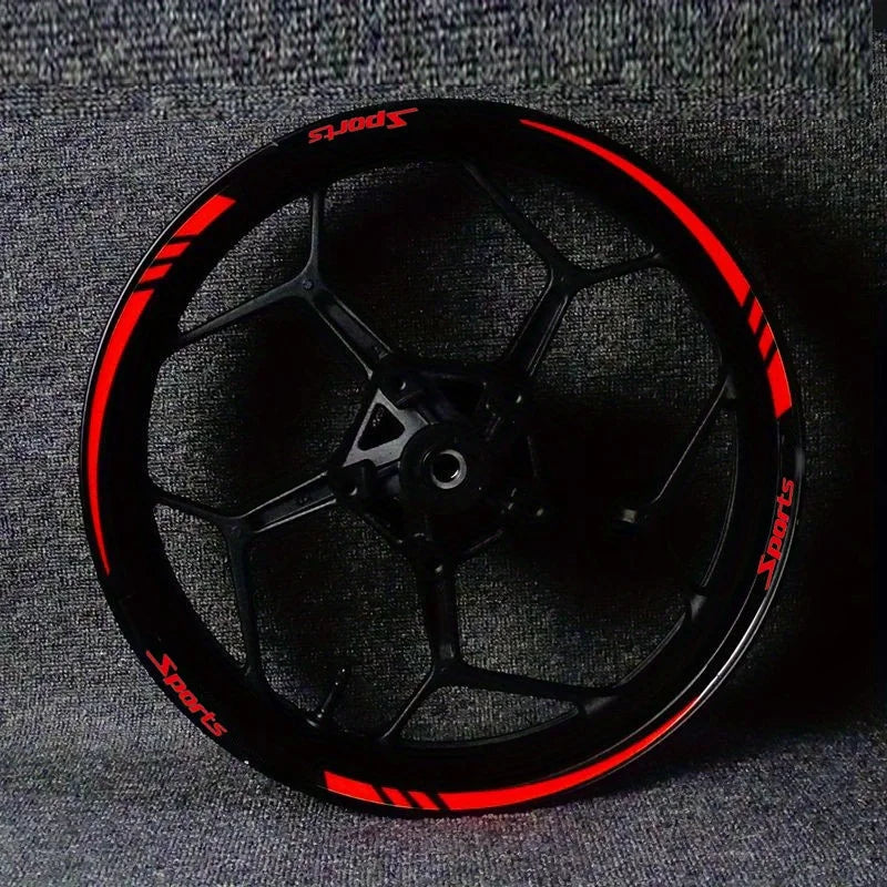 Black motorcycle wheel rim with red sports stripe decals and hub decoration