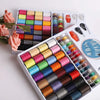 A kit of 64-color sewing thread spools arranged in a portable storage case.