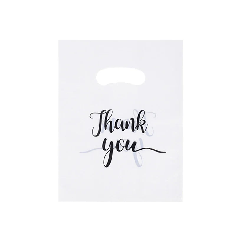A white card with the handwritten text Thank you