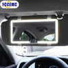 Interior view of a car showing an HD touch screen makeup mirror mounted on the windshield.