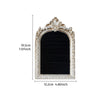 An arched resin jewelry display stand with a hand-painted floral design in a distressed white finish.