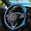 A close-up view of a blue and black patterned steering wheel cover on a car's interior.