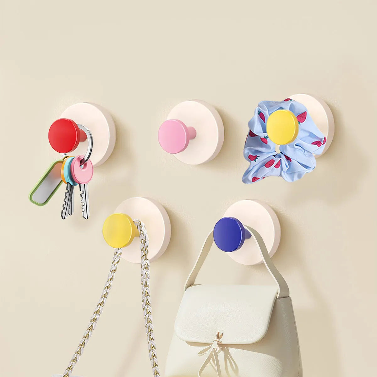 A collection of colorful suction cup hooks for keys and other items displayed against a light background.