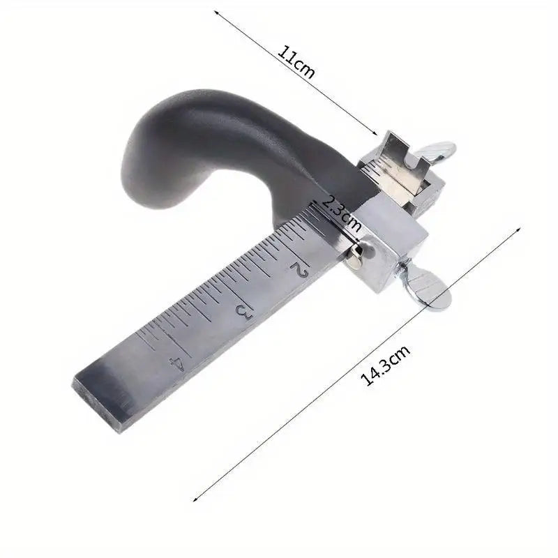 A silver adjustable leather strap cutter with a handle and scale markings showing dimensions.